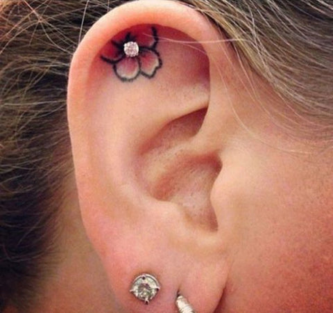 Cartilage Piercing Ideas with Tattoo at MyBodiArt