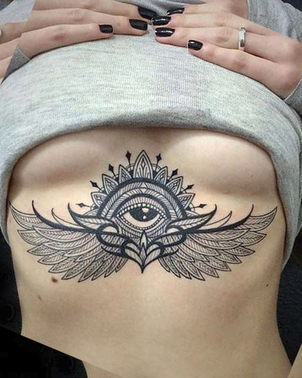 Women's Large Evil Eye Angel Wings Sternum Tattoo Ideas - www.MyBodiArt.com