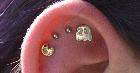 Can you guess what game inspired this cartilage / helix piercing ? Find the answer at MyBodiArt