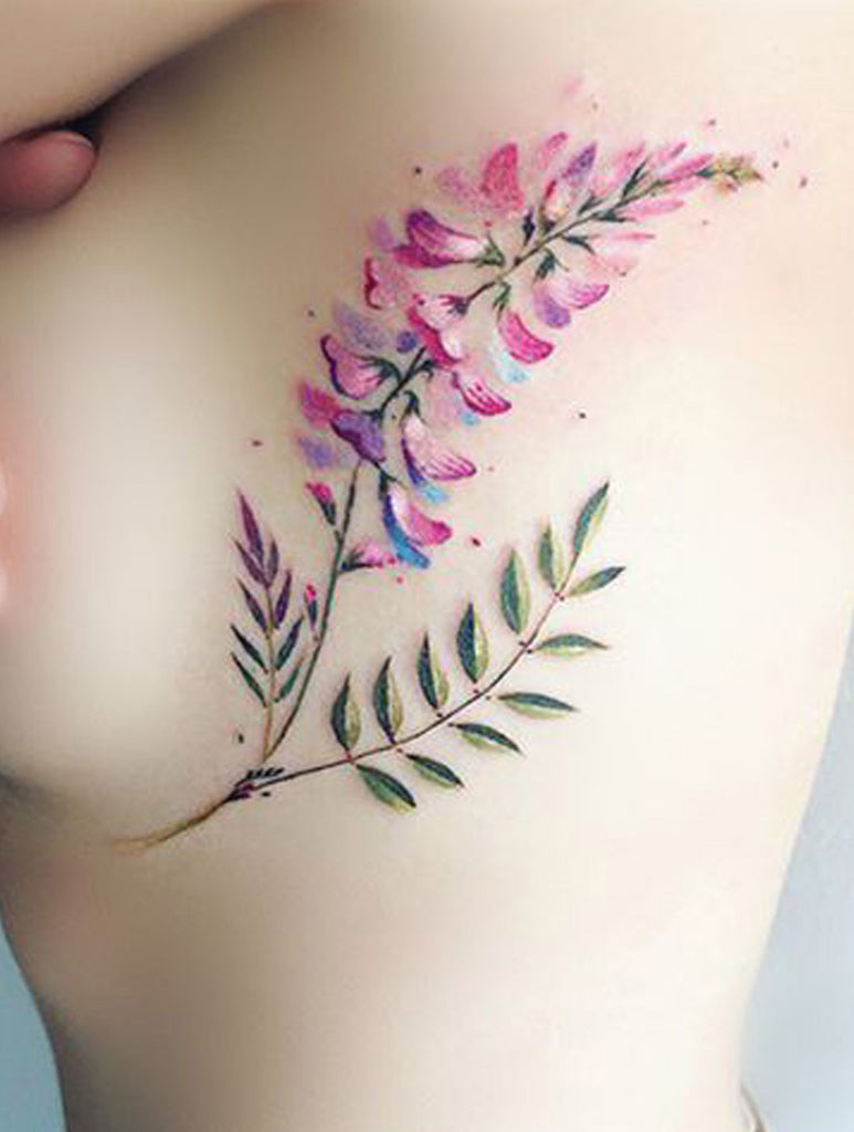 Watercolor Floral Flower Rib Tattoo Ideas for Women - www.MyBodiArt.com