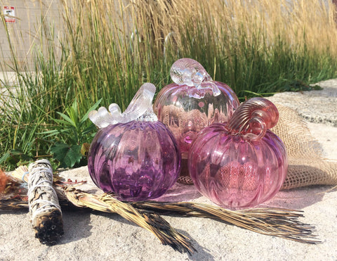 purple pumpkins outdoors by fall decor