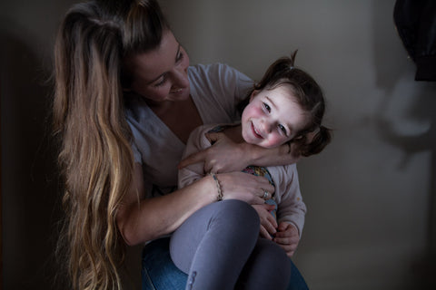 Strong as a Mother - Jenna Hobbs with Smiling Girl