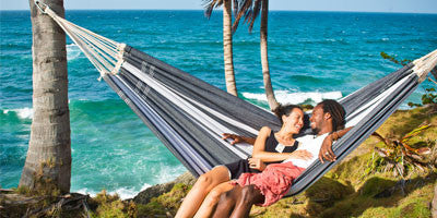 Couple on hammock by sea