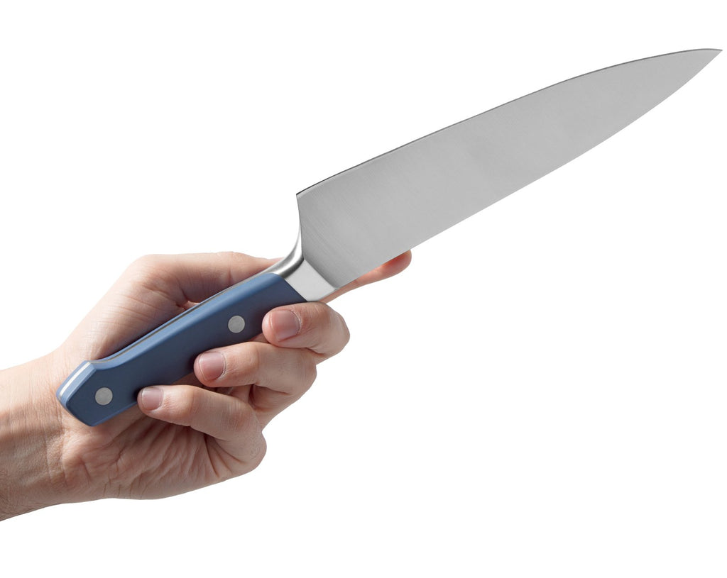 Chef knives: a man's hand holds a chef knife