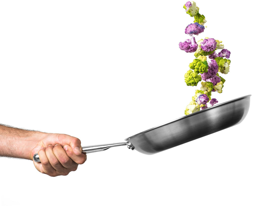 How to Sauté: Vegetables being tossed and cooked