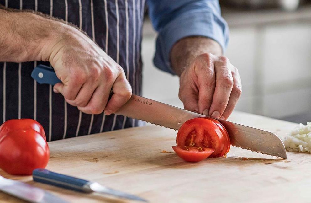 Chopped vs. diced: A chef slices tomatoes 