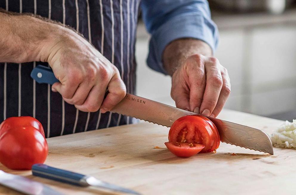 Batonnet cut: A chef slices tomatoes