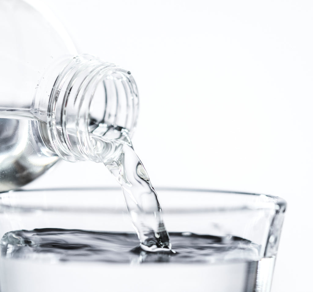 pouring water into a glass