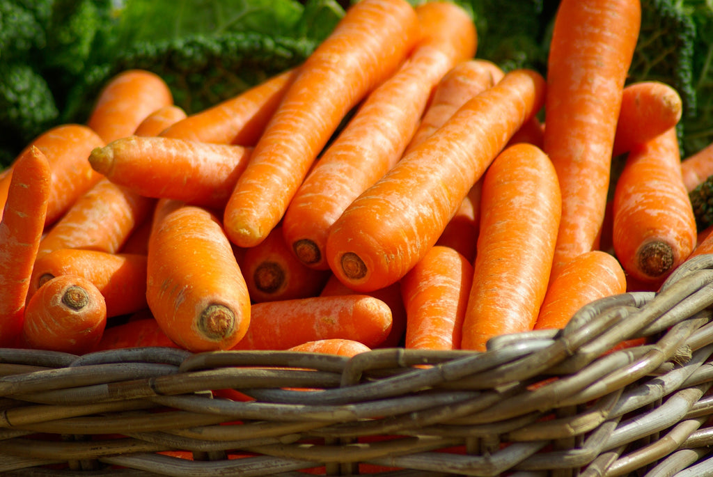 A basket of carrots ready to be batonnet cut