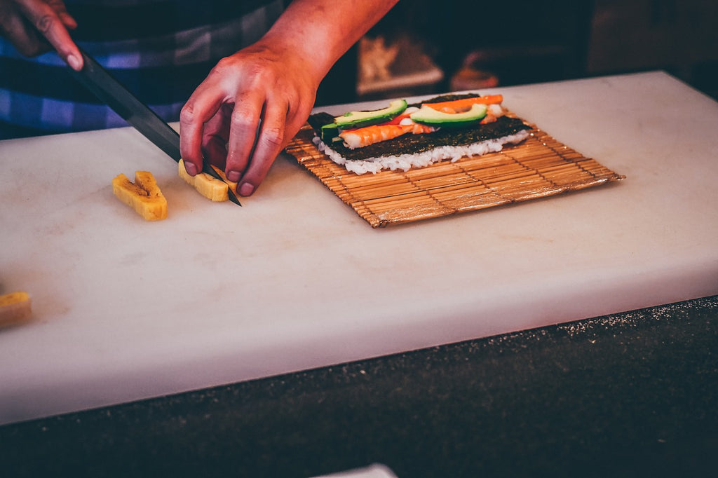 German knives: A chef makes sushi with a Japanese chef's knife