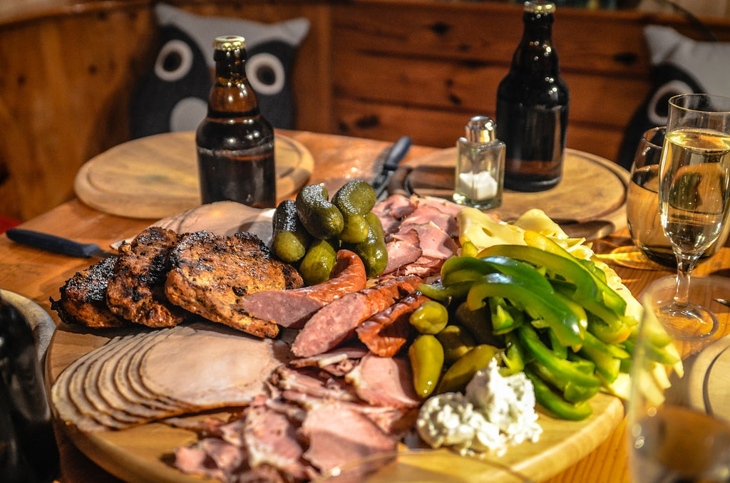 A large cutting board being used to serve charcuterie