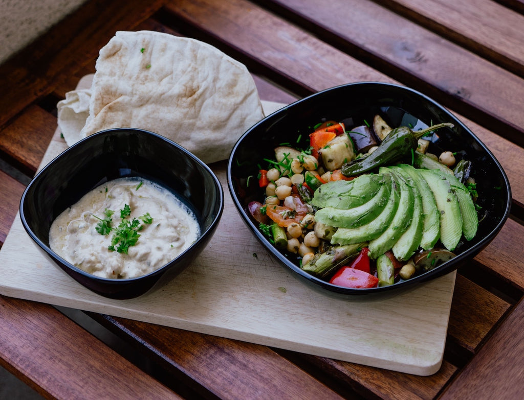 How to cut an avocado: sliced avocado on top of a grain bowl