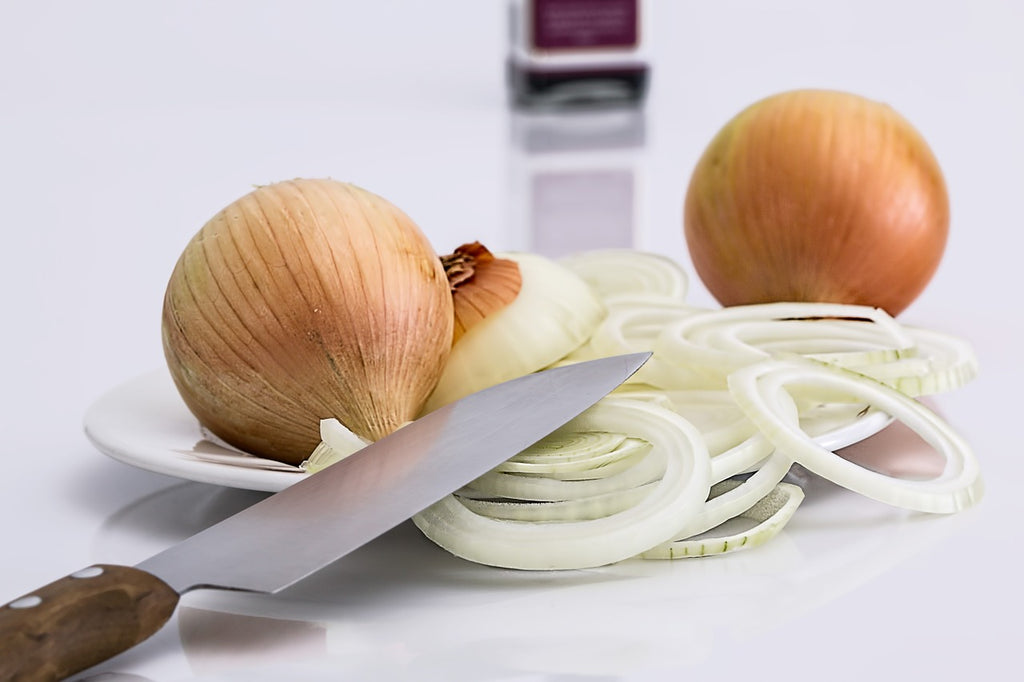 Rockwell hardness scale: a kitchen knife on a pile of sliced onions