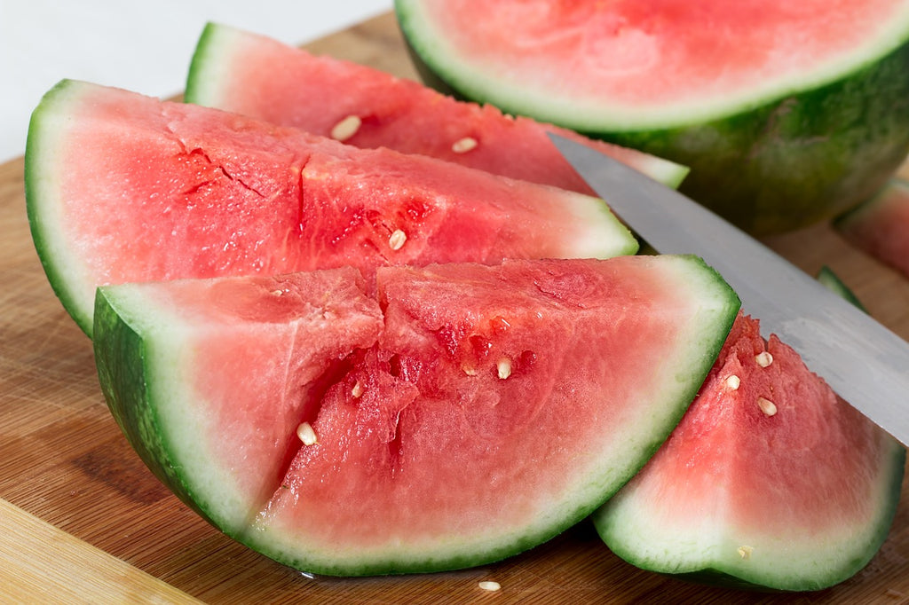 How to cut a watermelon: watermelon slices on a cutting board