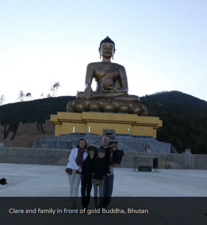 Clare and family in front of gold Buddha, Bhutan
