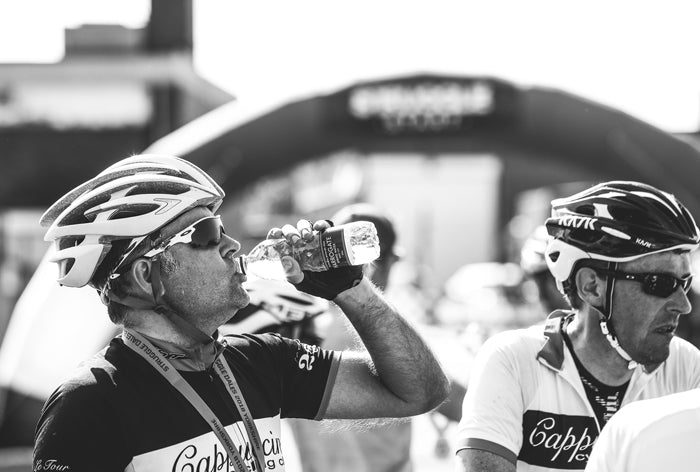 Cyclists drinking Harrogate Spring Water on Struggle Dales Sportive in Yorkshire 