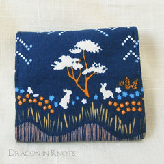 Dragon in Knots wallet prototype 2 closed - bunnies on navy blue