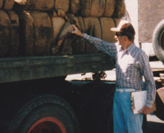 Mel Myland inspecting a load of burlap