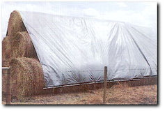 hay stack covered with Hay Tarp