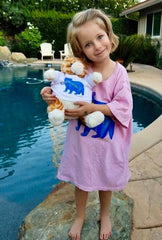 Whitney with new stuffed orange kitty. Both wearing Garlic Cat t-shirts.