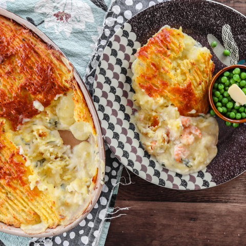 fantastic pished fish pie with creamy white wine sauce, smoked haddock, prawns served with peas