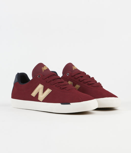 red and gold new balance