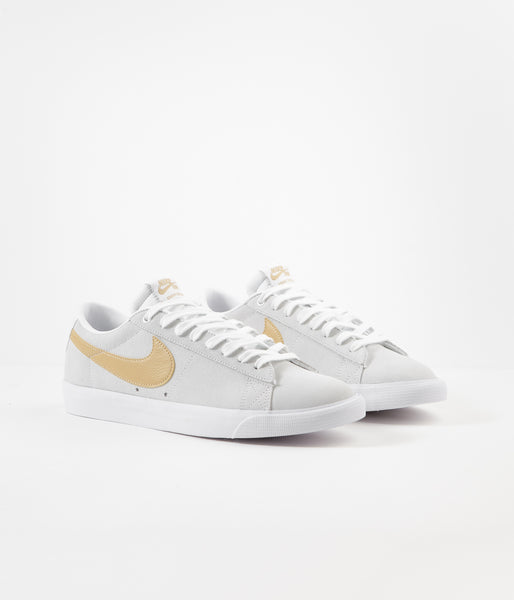 nike gold white shoes