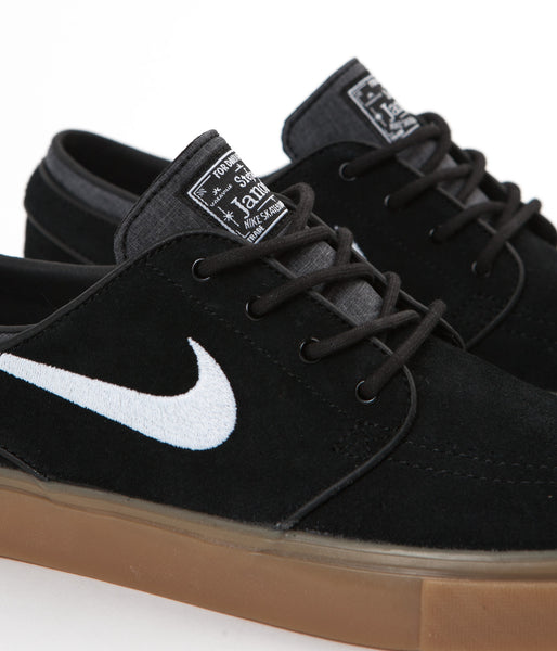 nike sb zoom janoski trainers in black with gum sole