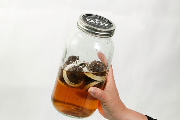 tayst coffee pods inside mason jar filled with coffee