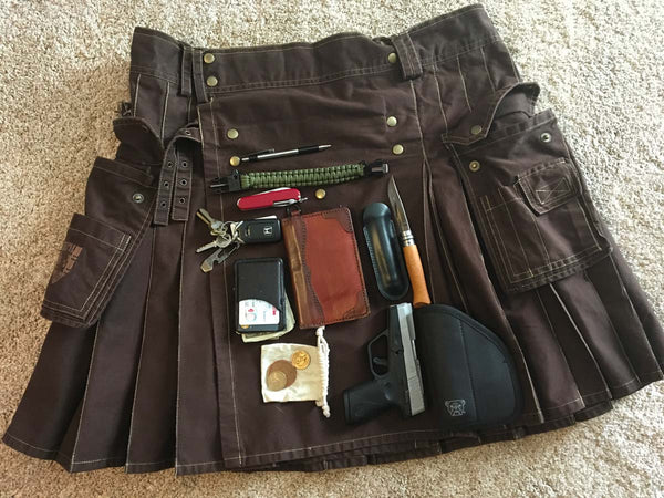 Pocket contents from a utility kilt include knives, tools, wallet, keys, and a pea shooter.
