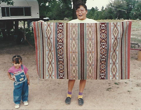 Frances Begay with her daughter and her Wide Ruin Rug