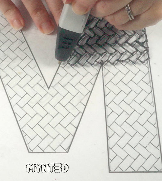 design patterns repeating for drawing with a 3D pen | construct decorative shapes, words, initials in repeating patterns: herringbone brick, scallop, geometric cubes, basket weave and quatrefoil | Get the free downloadable printable template from MYNT3D