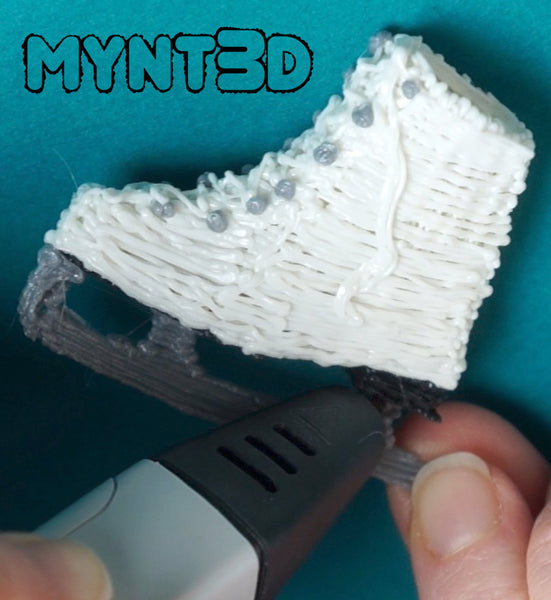 3D printing pen holiday project DIY ice skates for decorating, gift wrapping and handmade ornaments | Learn how with the full instructions and video tutorial and free printable template from MYNT3D