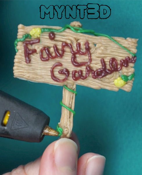 DIY Fairy garden sign made with a 3D printing pen using PLA wood filament | download the free project template from MYNT3D | Get more craft ideas and stencils 