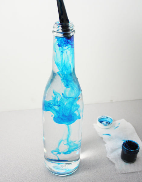 Make a DIY ring toss game with star-shaped rings made with a MYNT3D professional printing pen, dye the water in matching bottles with gel food coloring