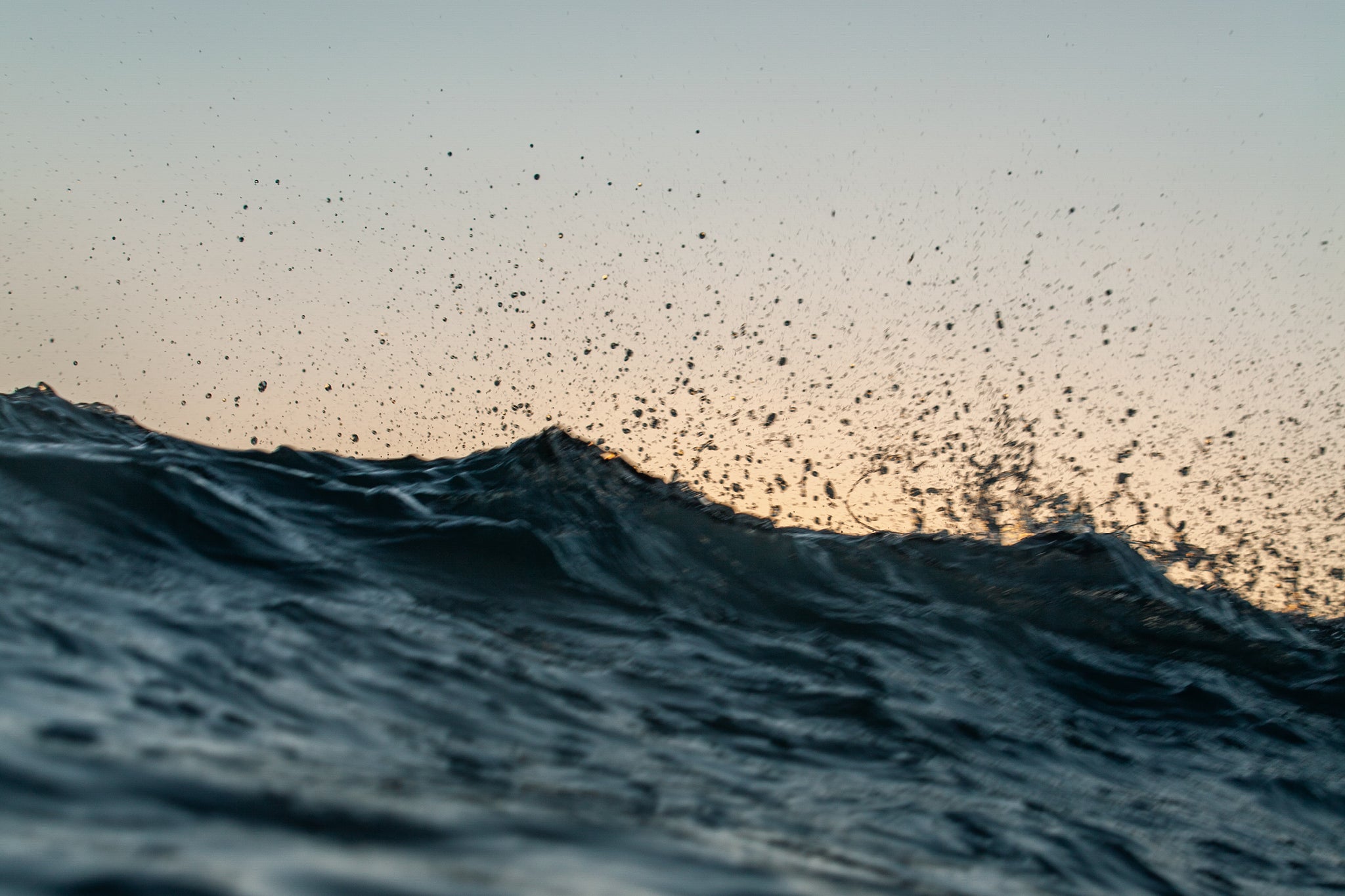 Hawaii ocean waves in sunset