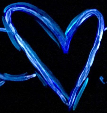 Glow in the dark heart as an example of raised edges in a brush stroke