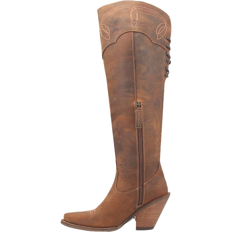 A tall brown leather boot with a short heel, stitched desings at the top and bottom, lace up back, fringe down the right side, and a half zipper. Item is pictured on a plain white background