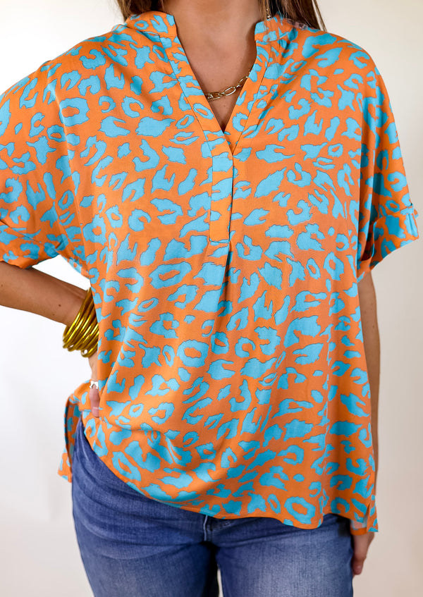 Bold and Beautiful V Neck Teal Leopard Print Top in Orange