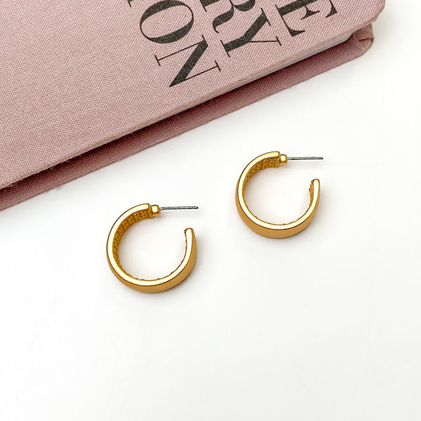 Gold Tone Hoop Earrings With a Textured Inside