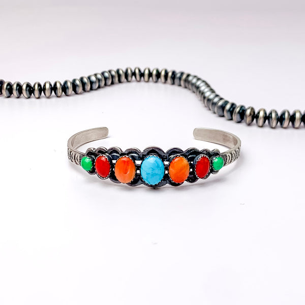 Russell Sam | Detailed Sterling Silver Cuff with Seven Multi-Colored Turquoise Stones