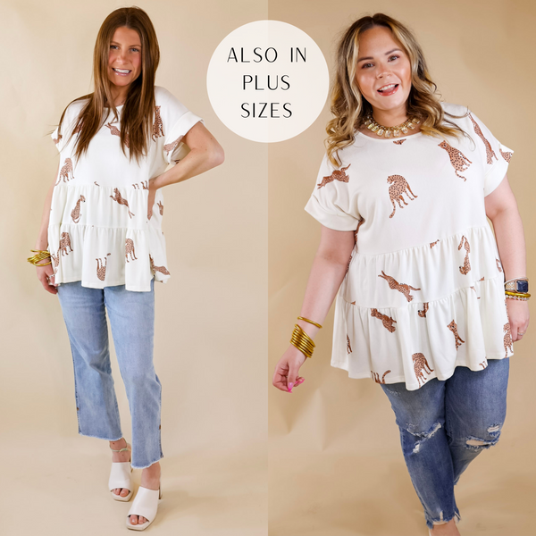 Model is wearing a tiered babydoll top with cheetahs printed all over. Size small model has this top paired with light wash jeans, ivory heels, and gold jewelry. Size large model has it paired with distressed jeans and gold jewelry.