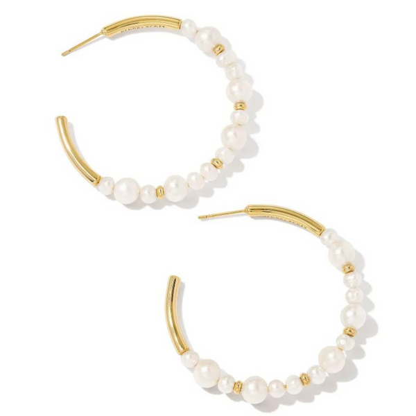 Gold hoop earrings with white pearl beads in varying sizes. These earrings are pictured on a white background. 