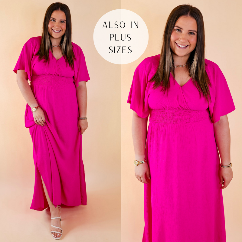 Model is wearing a hot pink maxi dress with short sleeves, a v neckline, and a smocked waist. Model has it paired with white heels and gold jewelry.