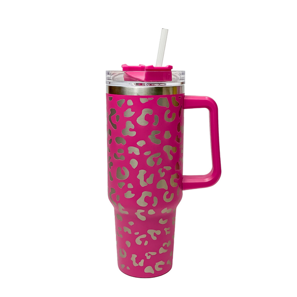 Pictured is a hot pink tumbler with a handle, clear straw, and a leopard print design. This tumbler is pictured on a white background. 
