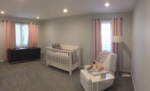 Insulated Grommet Blackout Curtains In a Baby Girl's Nursery