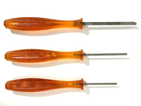 Three pumpkin carving saws