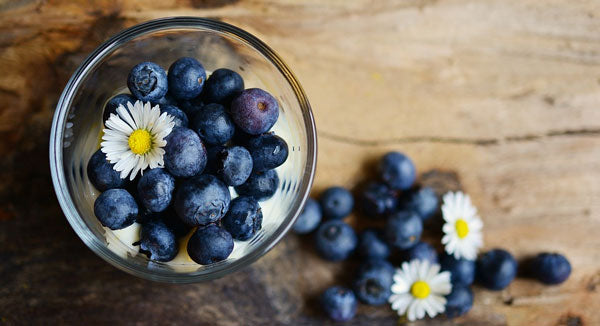 Glass filled with blueberries