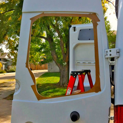 Freshly cut window opening for Mercedes Sprinter van rear door window