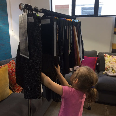 Designer Daughter viewing fashion fabrics